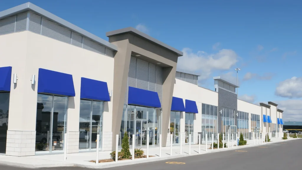 Retail strip center featuring individual storefront awnings