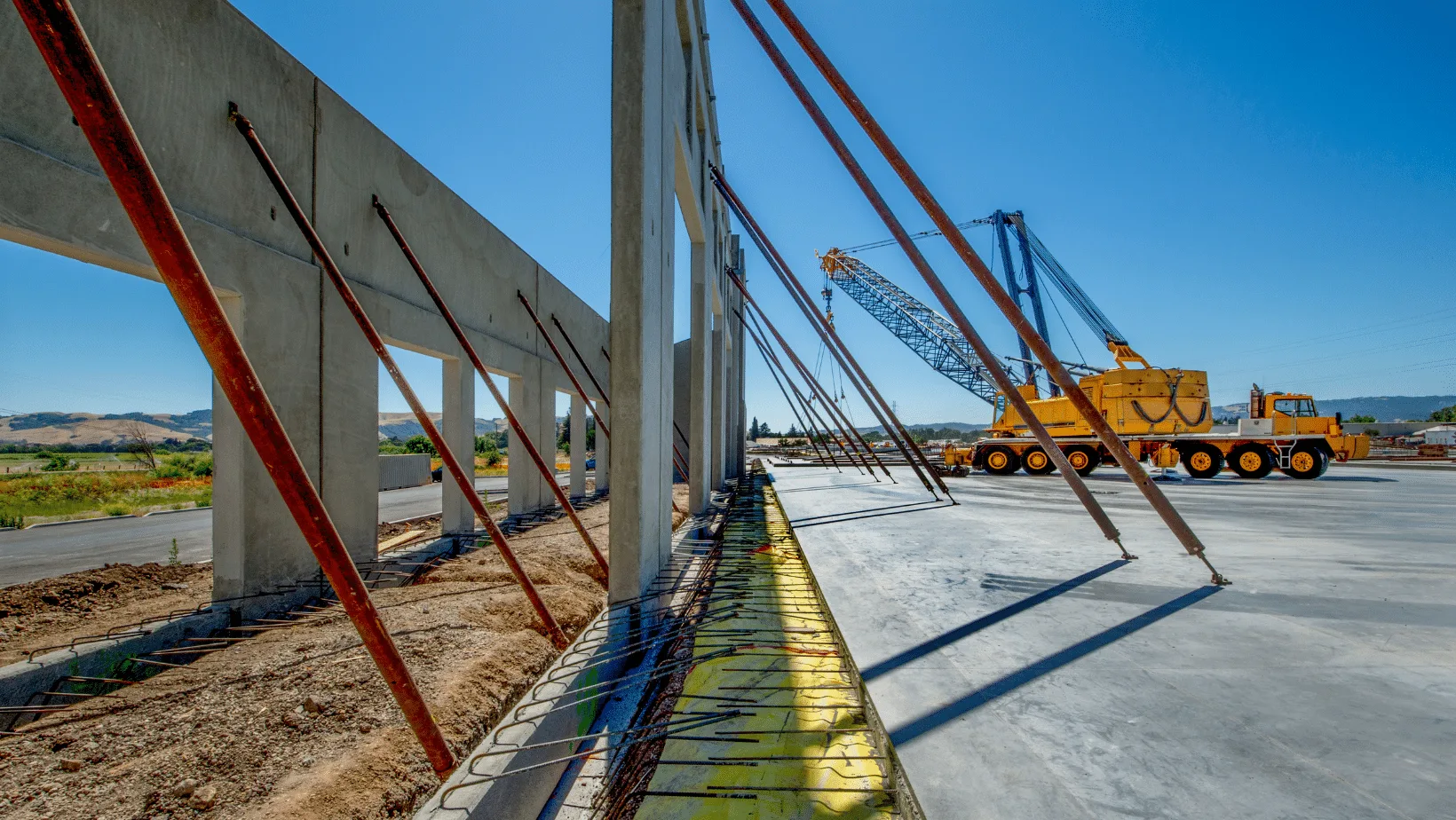 Tilt-up concrete panels braced in place during industrial plant construction