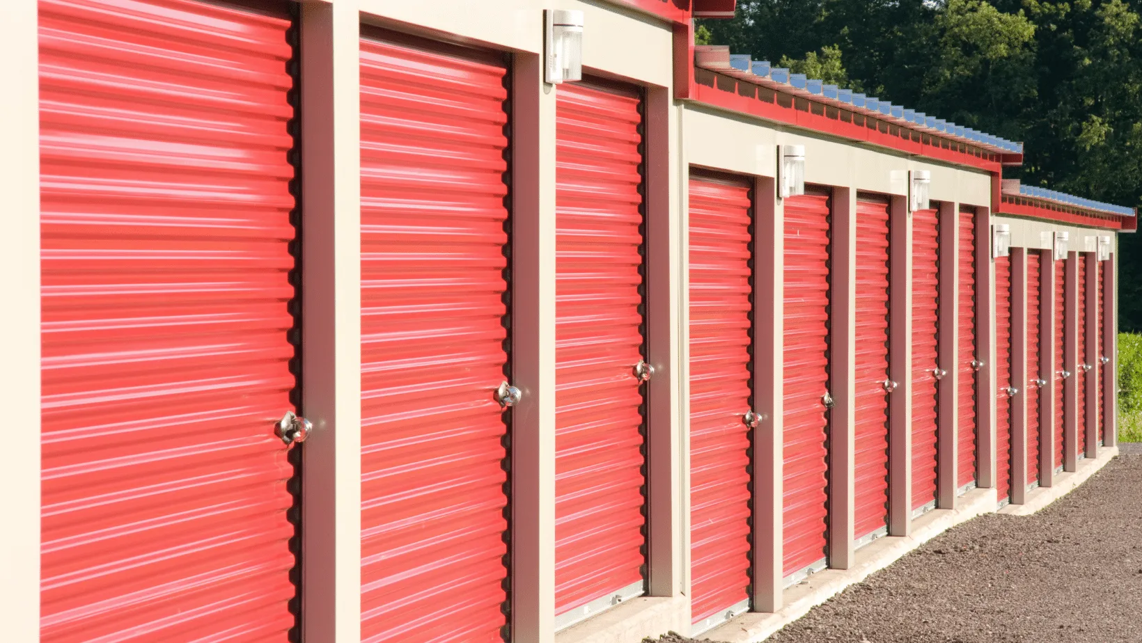 Tilt-up concrete storage building with red roll-up doors