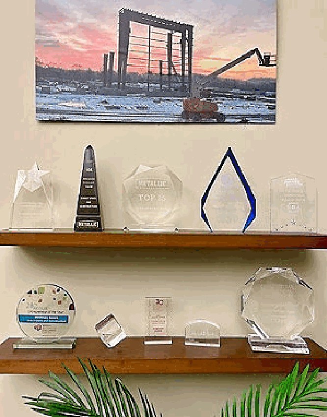 Shelf of glass and crystal industry awards in the Direct Steel office