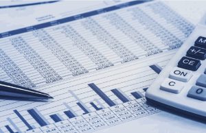 Construction cost spreadsheet and a calculator used to price materials