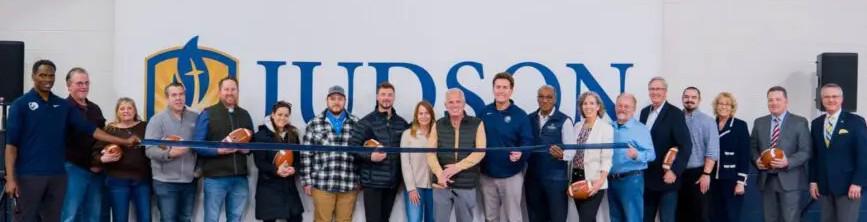 Direct Steel team members, Judson University leaders and student-athletes cutting the ribbon at the new athletic facility in Elgin, Illinois