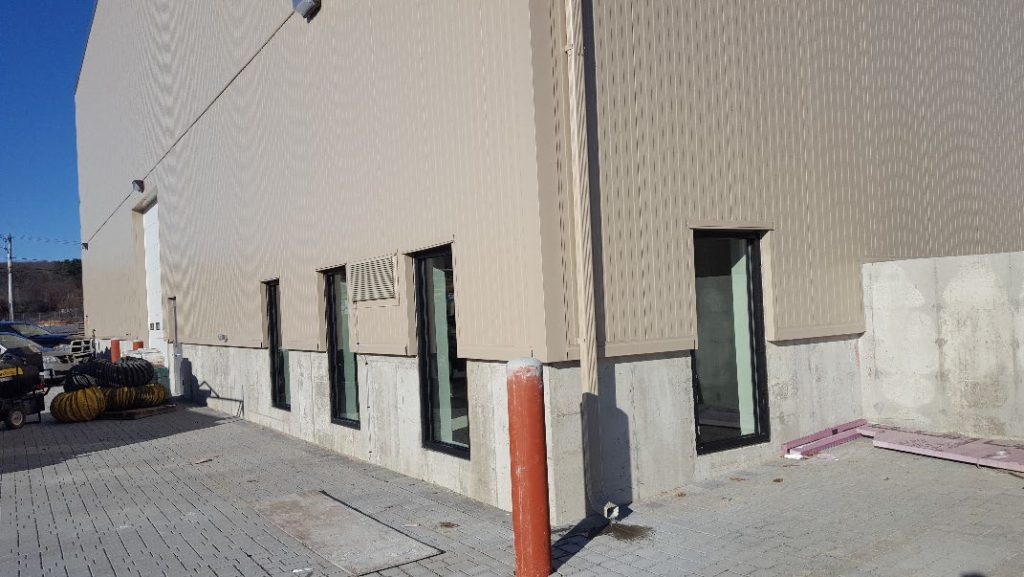 Finished interior room with a window and doorway inside a manufacturing building in Uxbridge, Massachusetts